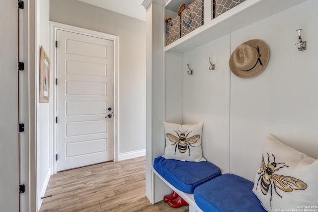 mudroom featuring light wood-type flooring and baseboards
