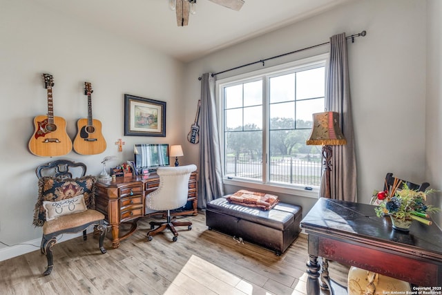 home office featuring wood finished floors and ceiling fan