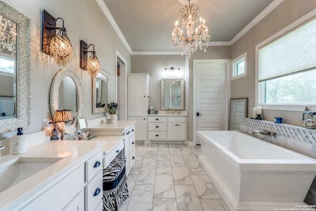 full bath featuring crown molding, two vanities, marble finish floor, a freestanding bath, and a notable chandelier