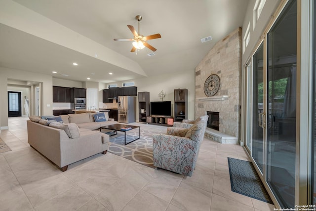 11347 Phoebe Lace, San Antonio, TX 78253 - living area featuring vaulted ceiling, recessed lighting, a fireplace, a ceiling fan, and visible vents