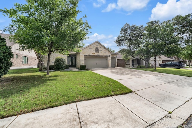 11347 Phoebe Lace, San Antonio, TX 78253 - view of front of home with concrete driveway, a front yard, stone siding, and an attached garage