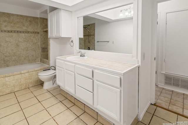 6826 Horwich, San Antonio, TX 78239 - bathroom with visible vents, toilet, vanity, tiled shower / bath combo, and tile patterned flooring