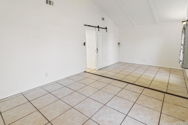 6826 Horwich, San Antonio, TX 78239 - empty room featuring visible vents, a barn door, beam ceiling, tile patterned floors, and high vaulted ceiling