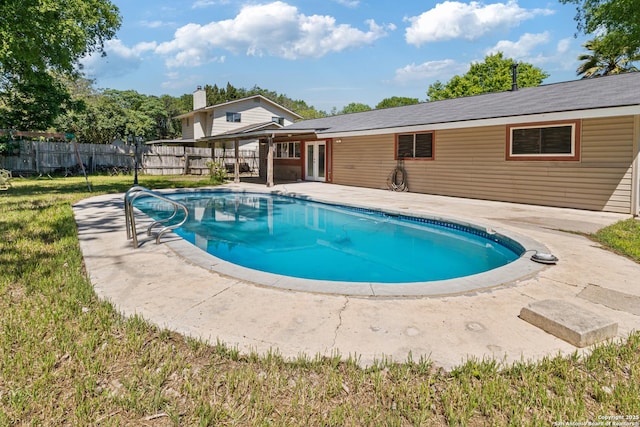 6826 Horwich, San Antonio, TX 78239 - view of swimming pool featuring a fenced in pool, french doors, a patio area, a fenced backyard, and a lawn