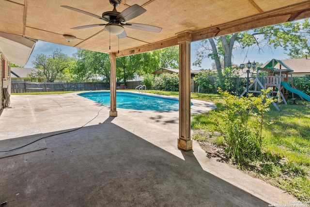 6826 Horwich, San Antonio, TX 78239 - view of swimming pool featuring a ceiling fan, a fenced backyard, a playground, a patio, and a fenced in pool
