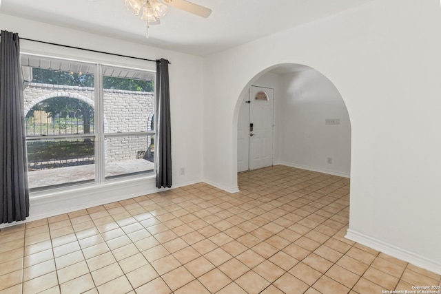 6826 Horwich, San Antonio, TX 78239 - spare room featuring arched walkways, baseboards, and a ceiling fan