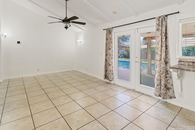 6826 Horwich, San Antonio, TX 78239 - unfurnished room featuring light tile patterned flooring, lofted ceiling with beams, a ceiling fan, and baseboards