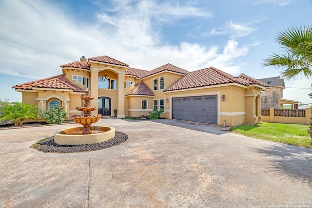 12022 Del Rio Run, San Antonio, TX 78245 - mediterranean / spanish-style home with a tiled roof, a garage, fence, stucco siding, and curved driveway