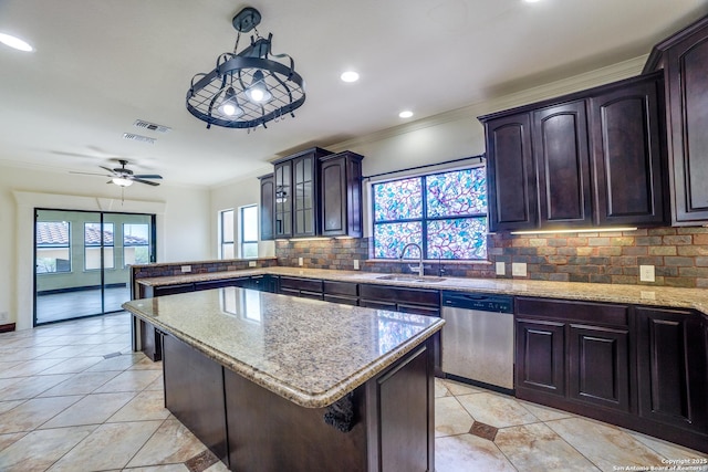 12022 Del Rio Run, San Antonio, TX 78245 - kitchen featuring a sink, a peninsula, crown molding, backsplash, and stainless steel dishwasher