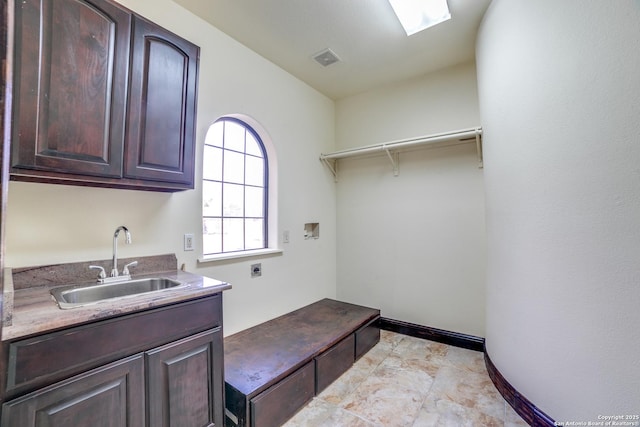 12022 Del Rio Run, San Antonio, TX 78245 - laundry area with electric dryer hookup, visible vents, washer hookup, a sink, and cabinet space