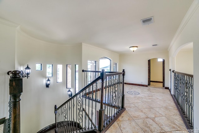 12022 Del Rio Run, San Antonio, TX 78245 - staircase with baseboards, ornamental molding, tile patterned flooring, visible vents, and arched walkways