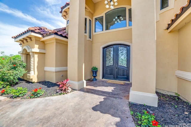 12022 Del Rio Run, San Antonio, TX 78245 - view of exterior entry with stucco siding, french doors, and a tile roof