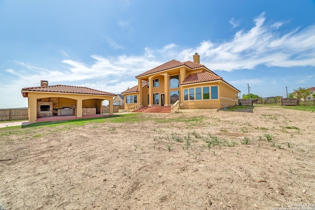 12022 Del Rio Run, San Antonio, TX 78245 - back of property featuring a chimney, stucco siding, fence, and a tile roof