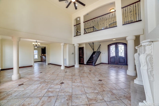 12022 Del Rio Run, San Antonio, TX 78245 - tiled foyer with baseboards, a high ceiling, ceiling fan with notable chandelier, stairs, and french doors