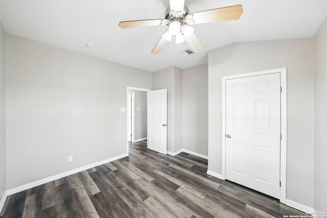 unfurnished bedroom with visible vents, dark wood-style flooring, baseboards, and a ceiling fan