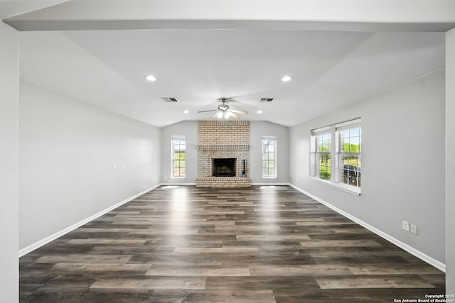 unfurnished living room featuring dark wood-type flooring, vaulted ceiling, a ceiling fan, and visible vents