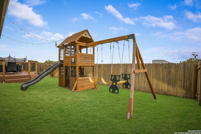 view of play area featuring a fenced backyard and a lawn