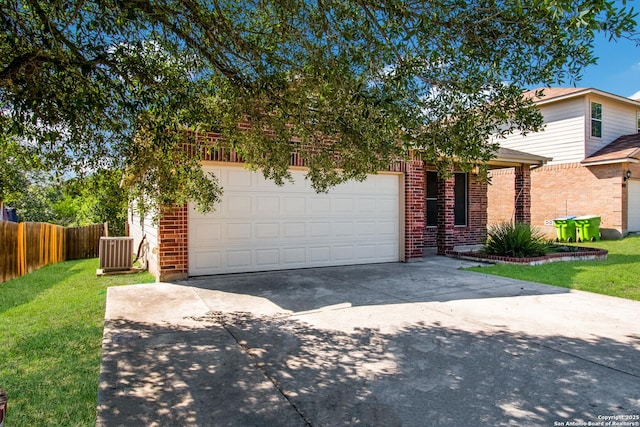 view of front facade with brick siding, driveway, fence, and an attached garage