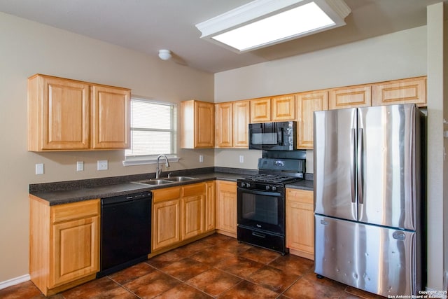 kitchen featuring a sink, black appliances, light brown cabinetry, and dark countertops