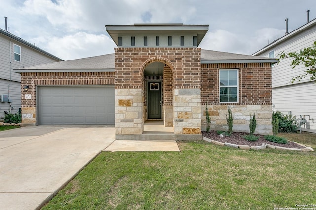 view of front of property featuring roof with shingles, driveway, stone siding, an attached garage, and a front lawn
