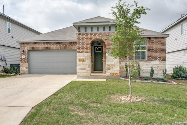 view of front facade with driveway, stone siding, a front yard, brick siding, and a garage