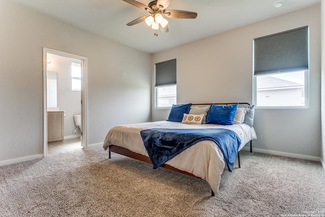 bedroom with baseboards, multiple windows, and carpet