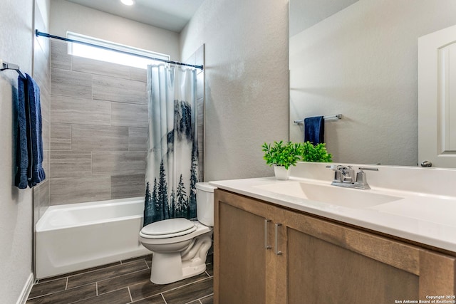 full bathroom with a textured wall, vanity, wood tiled floor, and toilet