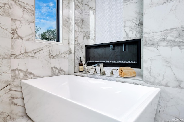 full bathroom featuring a freestanding tub