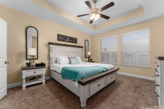 14047 Pikesdale, San Antonio, TX 78253 - bedroom featuring dark colored carpet, ceiling fan, baseboards, and a raised ceiling