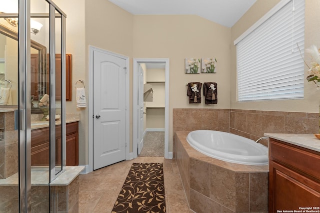14047 Pikesdale, San Antonio, TX 78253 - full bathroom with a garden tub, a shower stall, vanity, lofted ceiling, and tile patterned floors