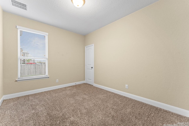 14047 Pikesdale, San Antonio, TX 78253 - carpeted spare room with visible vents, baseboards, and a textured ceiling