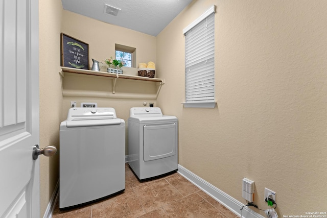 14047 Pikesdale, San Antonio, TX 78253 - laundry area featuring baseboards, tile patterned flooring, visible vents, independent washer and dryer, and laundry area