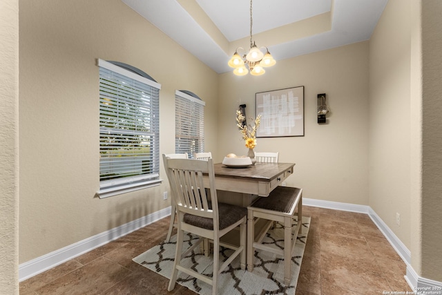 14047 Pikesdale, San Antonio, TX 78253 - dining area with a tray ceiling, a chandelier, and baseboards