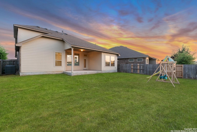 14047 Pikesdale, San Antonio, TX 78253 - rear view of house featuring cooling unit, a patio area, a fenced backyard, a yard, and a playground