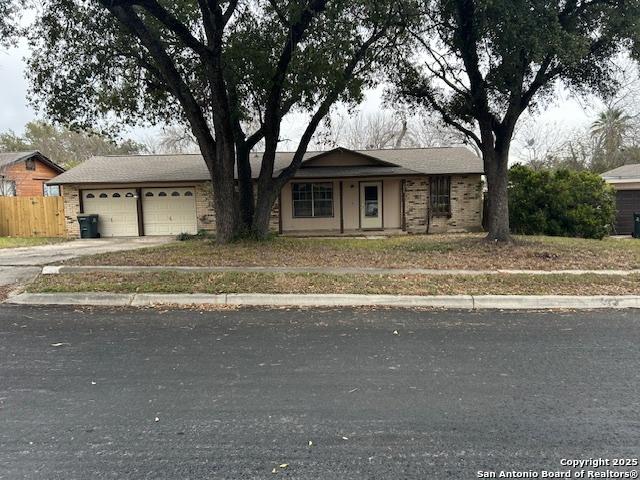 7834 Sun Frst, San Antonio, TX 78239 - single story home with driveway, fence, and a garage