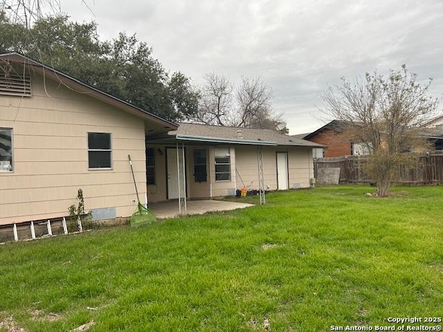 7834 Sun Frst, San Antonio, TX 78239 - rear view of house with a patio area, fence, and a lawn