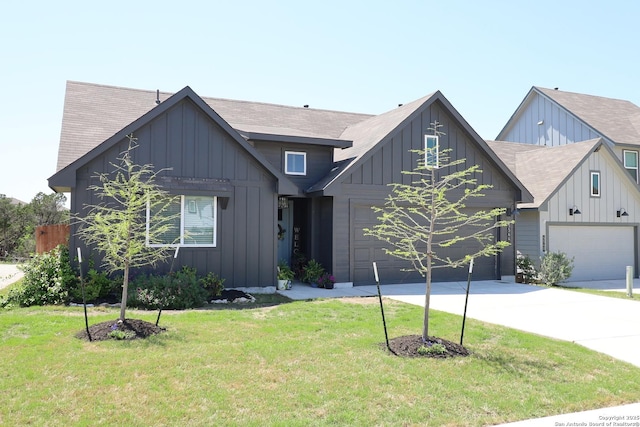 5544 Jewel, San Antonio, TX 78266 - view of front of home with board and batten siding, driveway, and a front yard