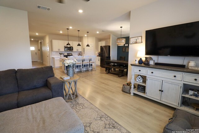5544 Jewel, San Antonio, TX 78266 - living room featuring recessed lighting, visible vents, and light wood-type flooring