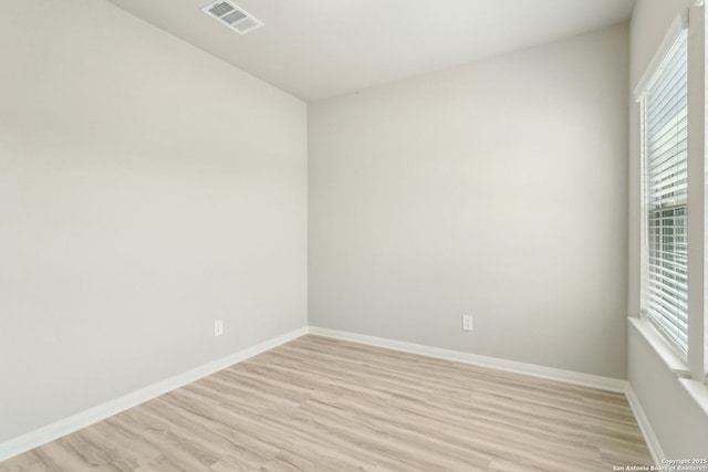 18107 Ansley, San Antonio, TX 78247 - unfurnished room with light wood finished floors, visible vents, and baseboards