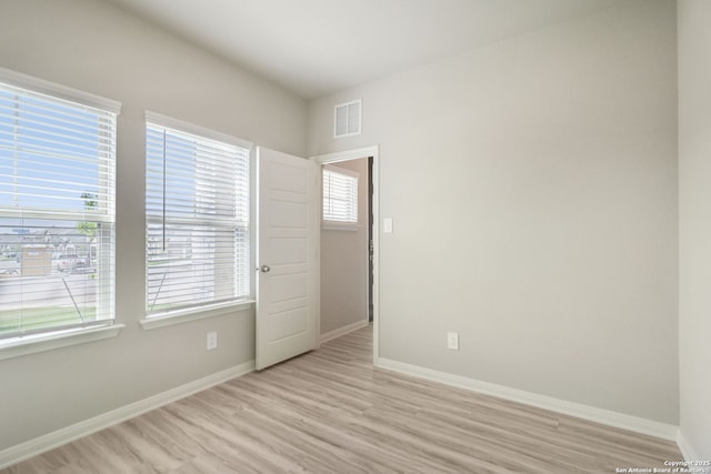 18107 Ansley, San Antonio, TX 78247 - empty room with light wood finished floors, baseboards, and visible vents