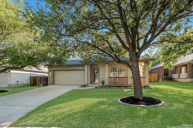 view of front of house with a front lawn, fence, and driveway