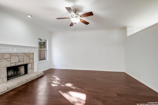 unfurnished living room with baseboards, wood finished floors, ornamental molding, and ceiling fan