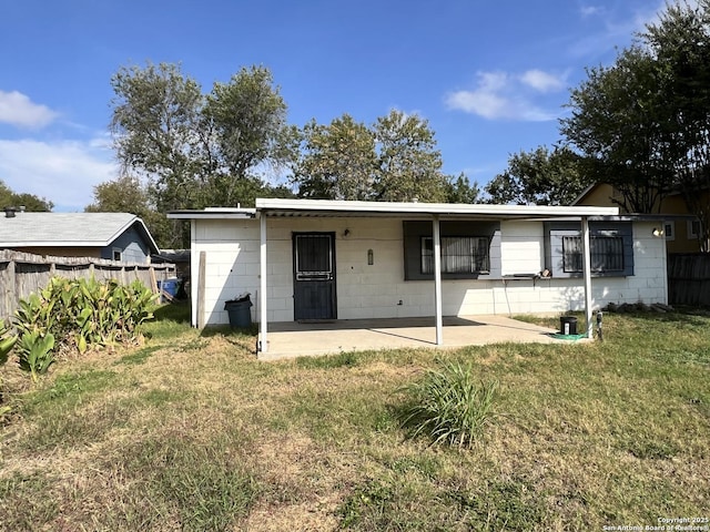 5874 Castle Hunt, San Antonio, TX 78218 - rear view of house with a yard, fence, and a patio