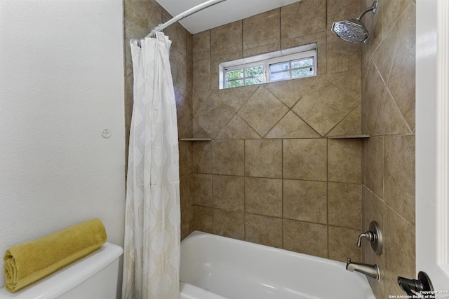 full bath with shower / tub combo and toilet