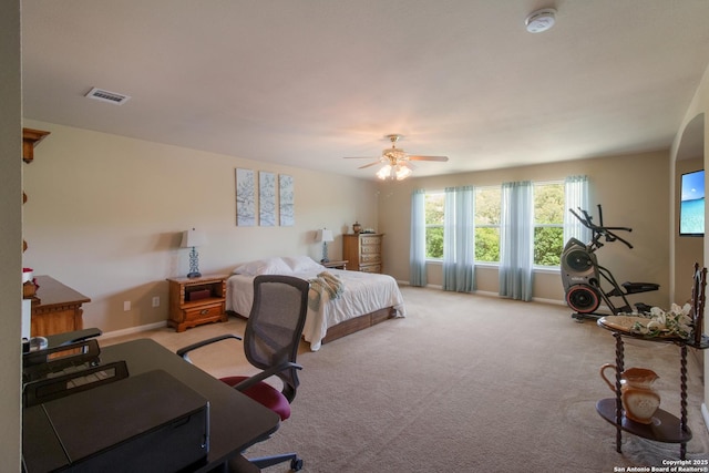 bedroom with visible vents, ceiling fan, baseboards, and carpet floors