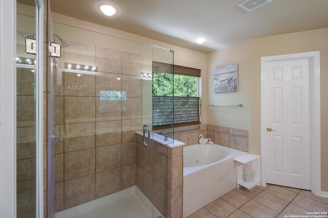 bathroom featuring a shower stall, a bath, tile patterned flooring, and visible vents