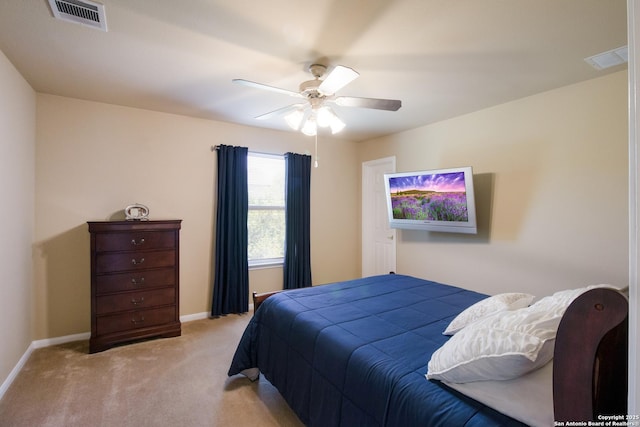 bedroom with carpet flooring, visible vents, baseboards, and a ceiling fan