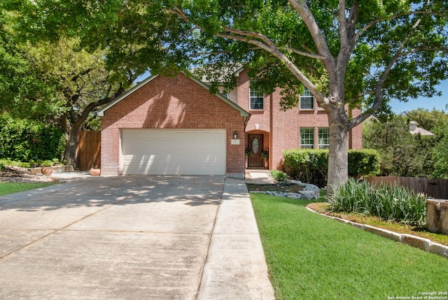 view of front of house featuring an attached garage, fence, concrete driveway, brick siding, and a front lawn