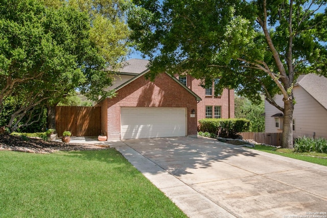 view of front of home featuring an attached garage, driveway, fence, and a front lawn