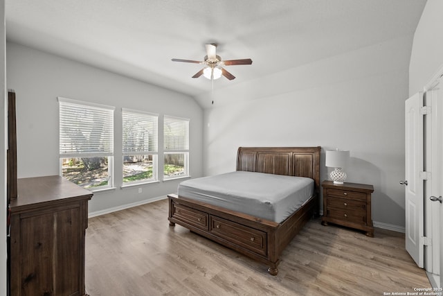 7635 Mission Smt, Boerne, TX 78015 - bedroom featuring baseboards, light wood-type flooring, lofted ceiling, and a ceiling fan